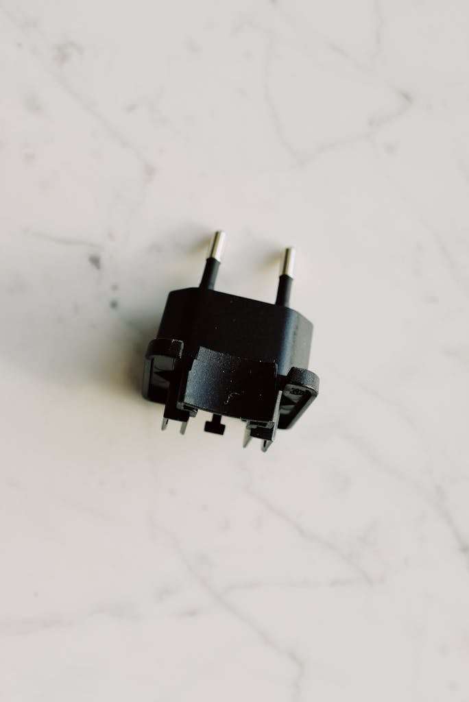 Black Adapter On White Surface